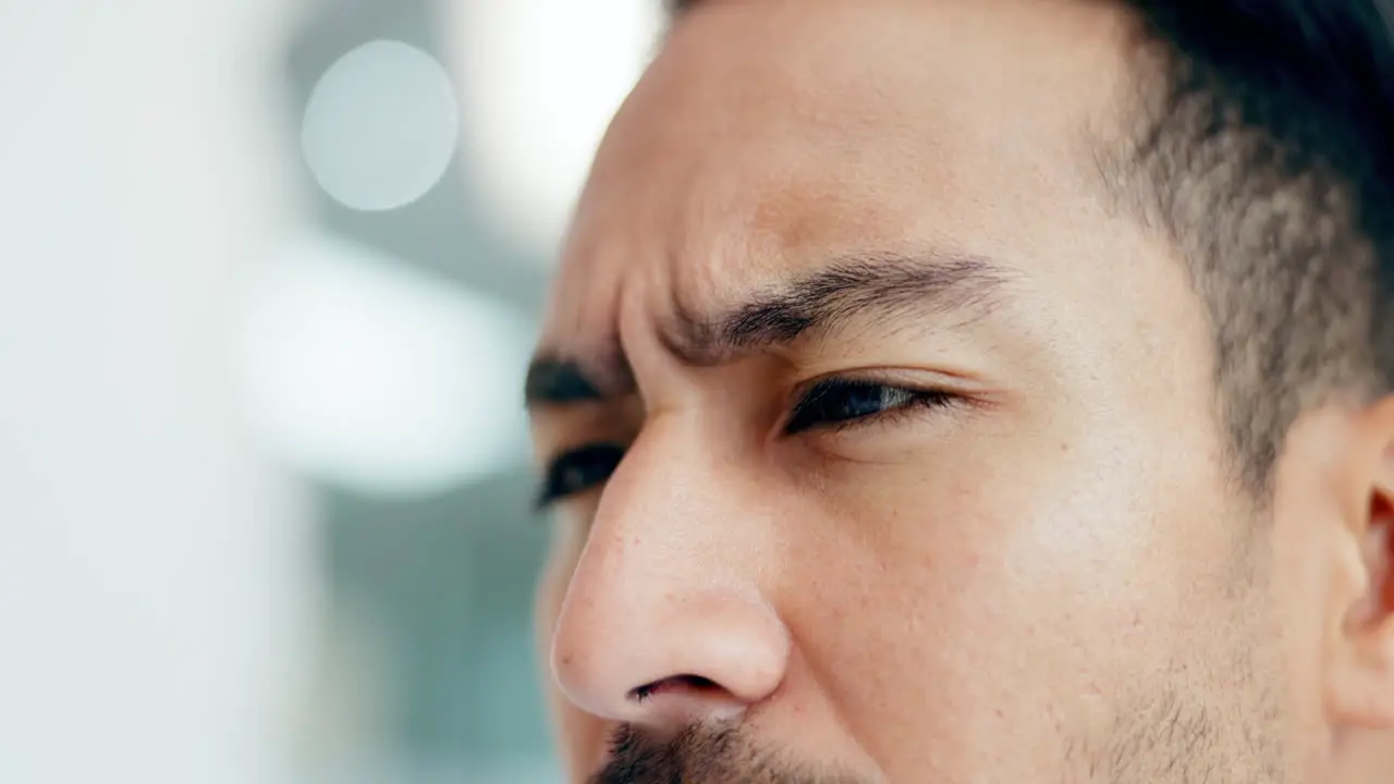 Face of man reading and thinking in office