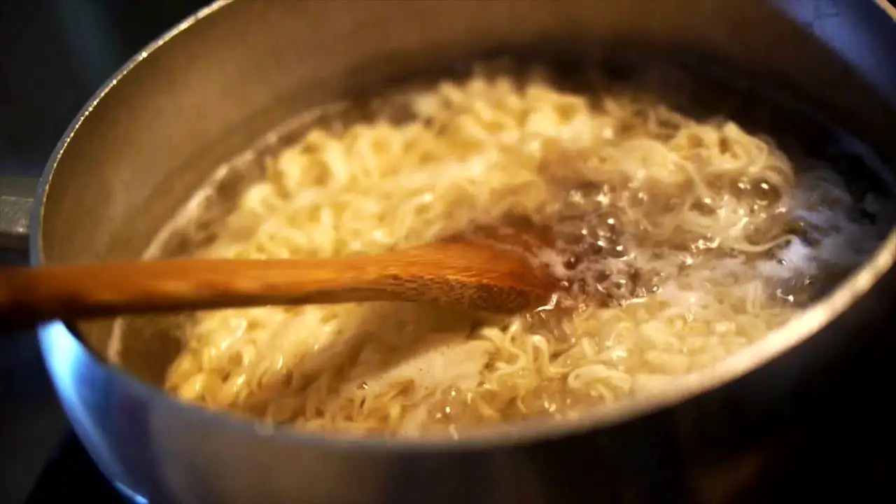 Ramen noodles boiling on the stove