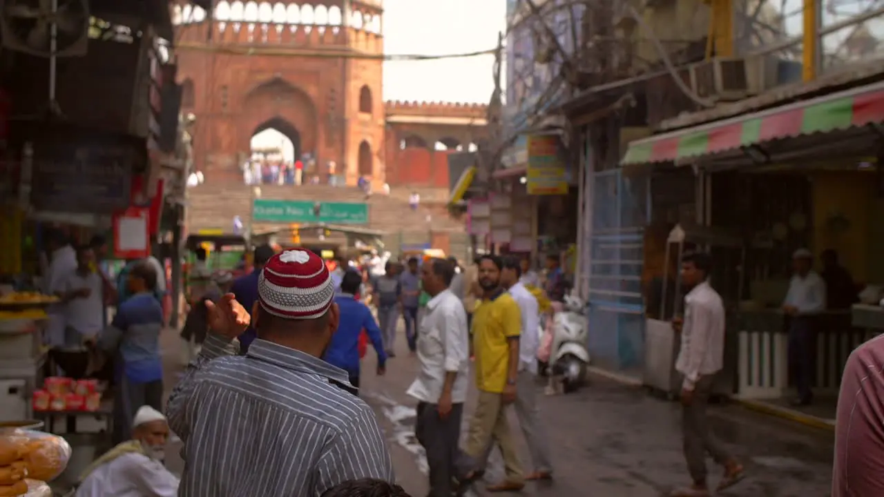 Man Beckoning on Crowded Indian Street