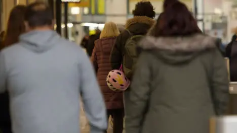 Long Shot of People Walking Into Shopping Centre In Oxford England