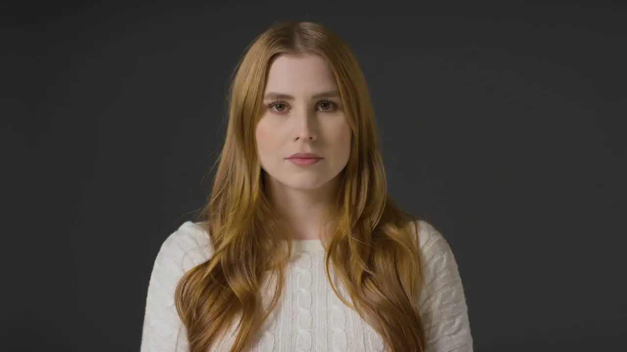 Mid Shot of Young Woman with Neutral Expression 