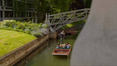 Tracking Shot Revealing Gondolas Underneath Mathematical Bridge 