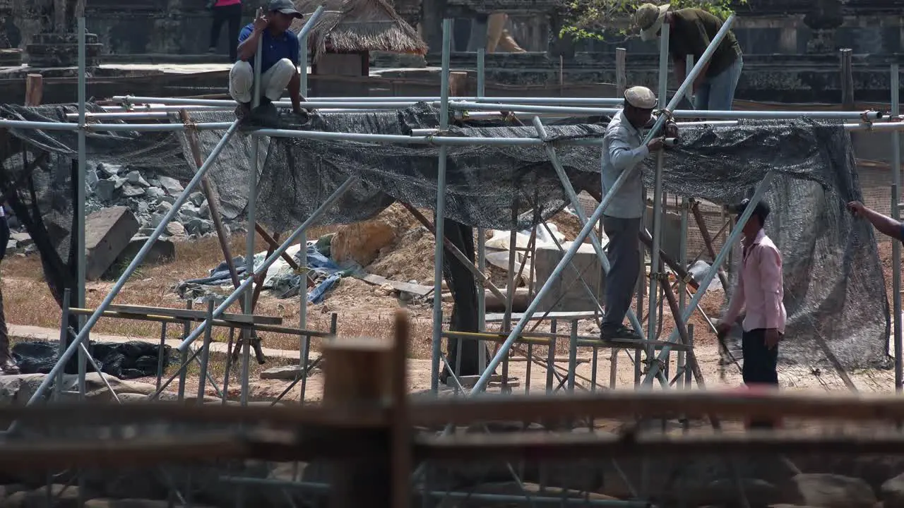 Time Lapse of Men Working on a Construction Site on a Metal Frame