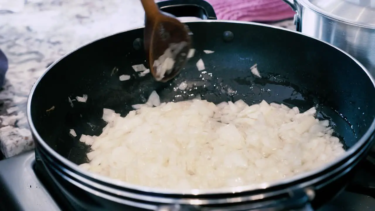 Frying diced onions in frying pan