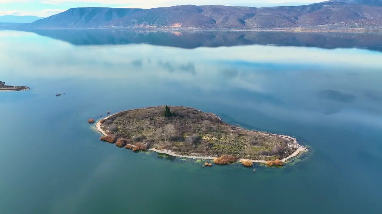 Flying around an island in a calm lake