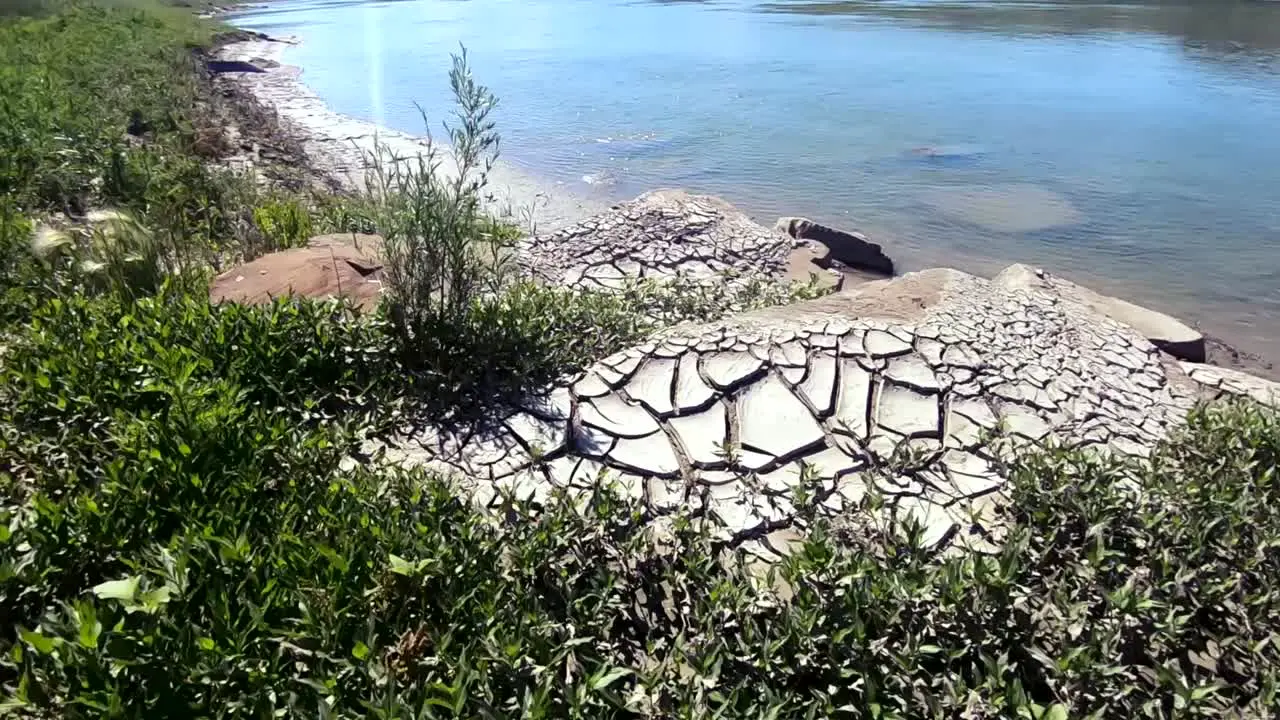 Mountain of cracked nature clay on the shore of a river at Sandy Point Alberta Canada