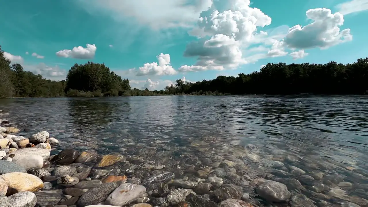 river stream running fresh water on pebble stone perfect sunny summer day in pure nature