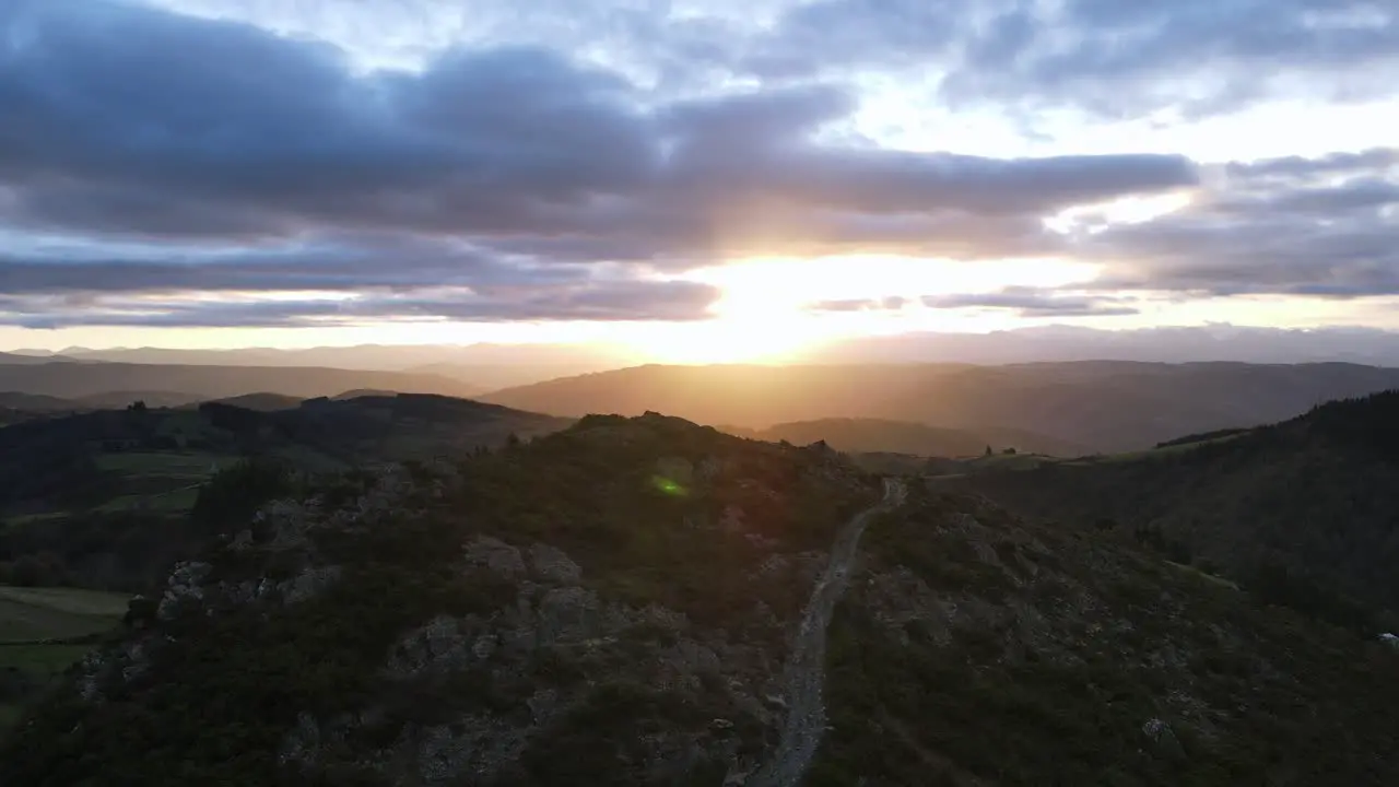 View over mountain road at sunrise in idyllic lonely and peaceful nature scene in Spain