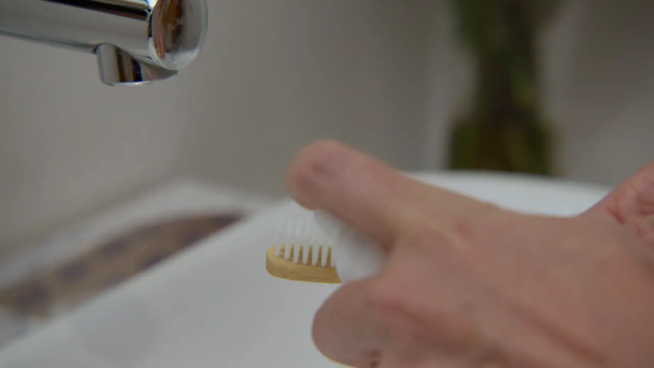 Applying foam on a tooth brush close up