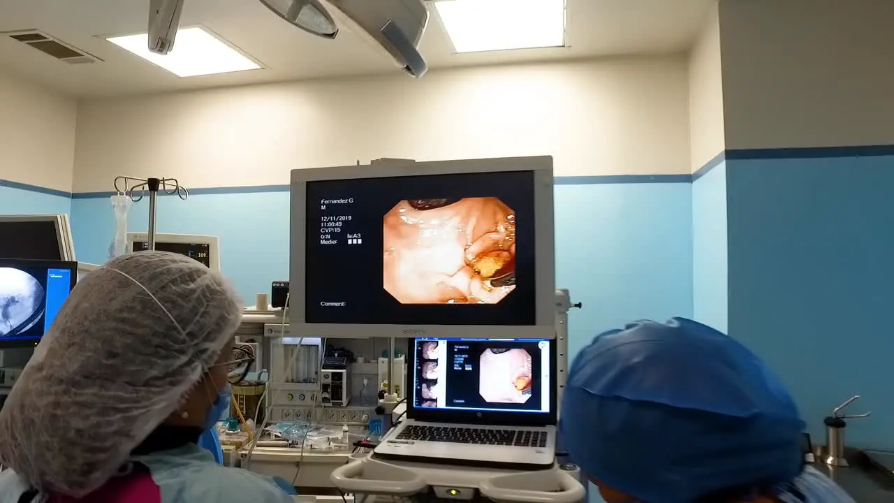 doctors performing a laparoscopic gastric bypass surgery in an operating room