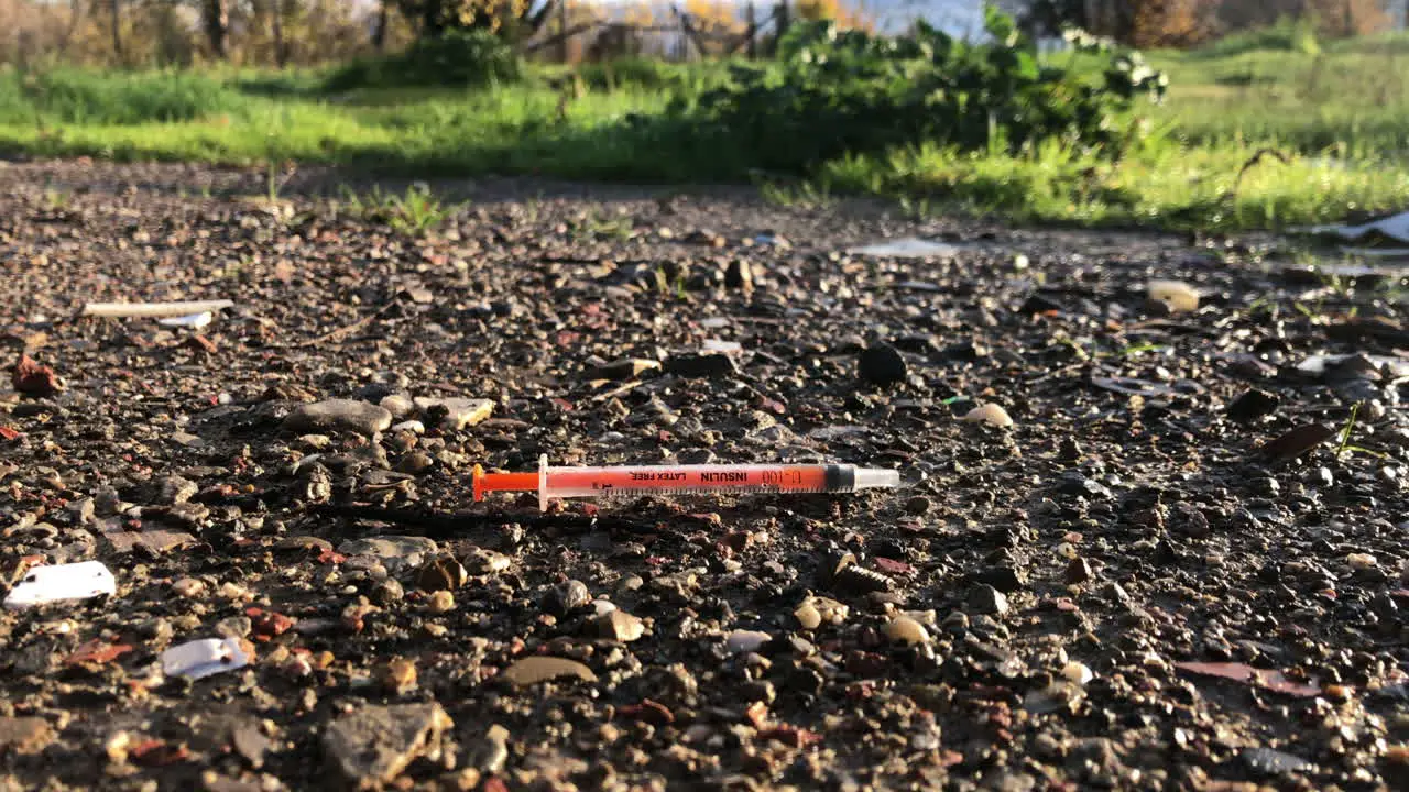 Insulin syringe on the floor