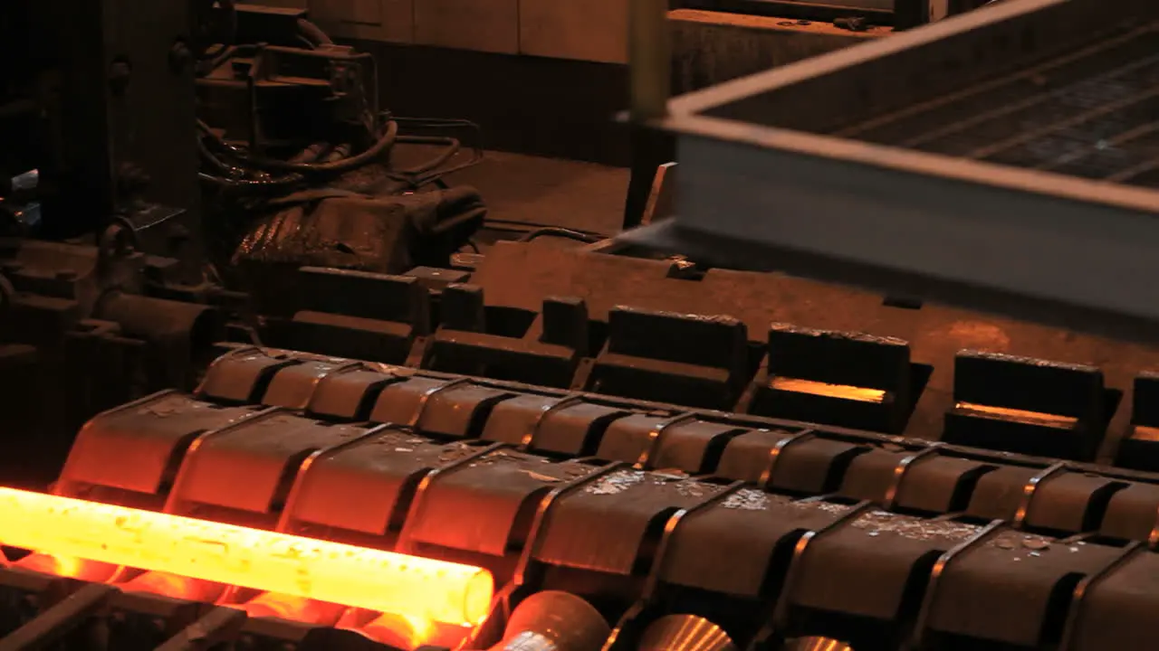 Manufacturing process of metal pipe on production line at metal factory