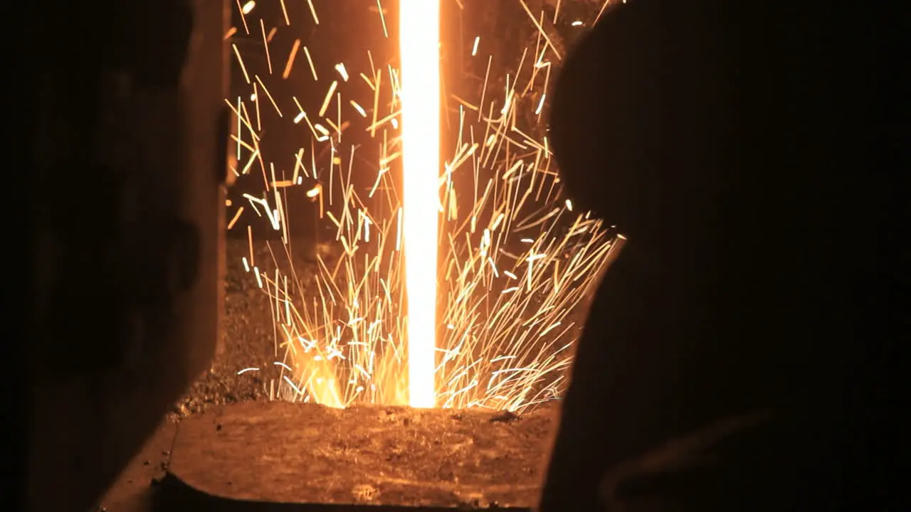 Stream of liquid metal with sparks Iron and steel production