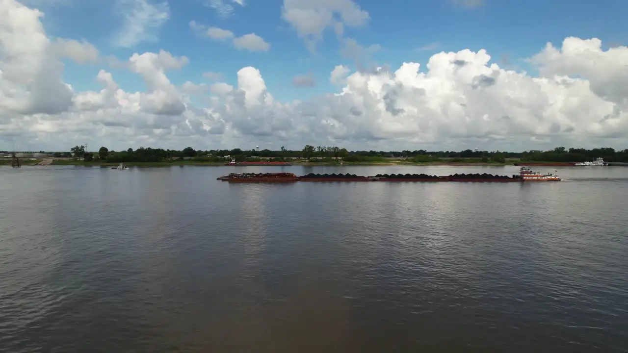 Editorial aerial footage of a barge ship on the Mississippi River in Baton Rouge Louisiana