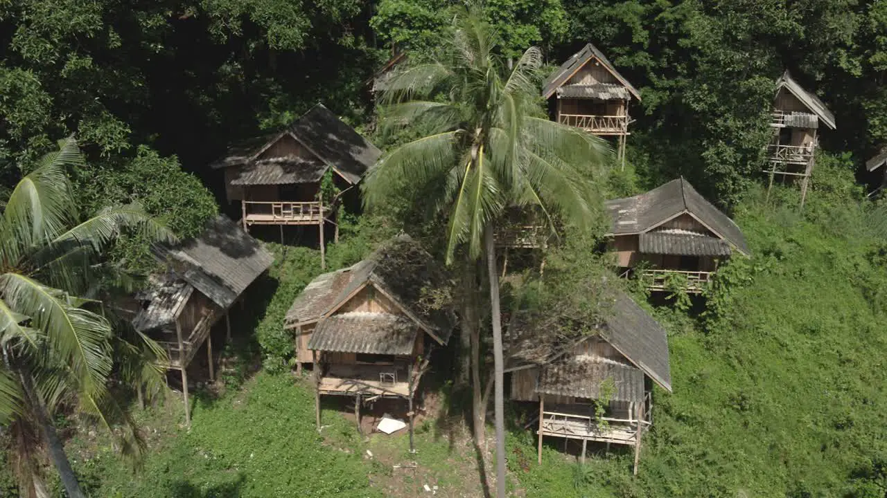 Aerial trucking run down empty Thai bungalows pandemic travel restrictions