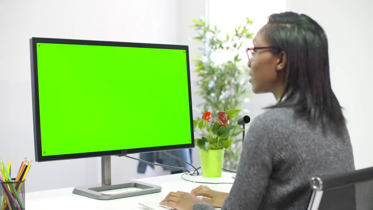 Woman Working at Computer Chroma Screen