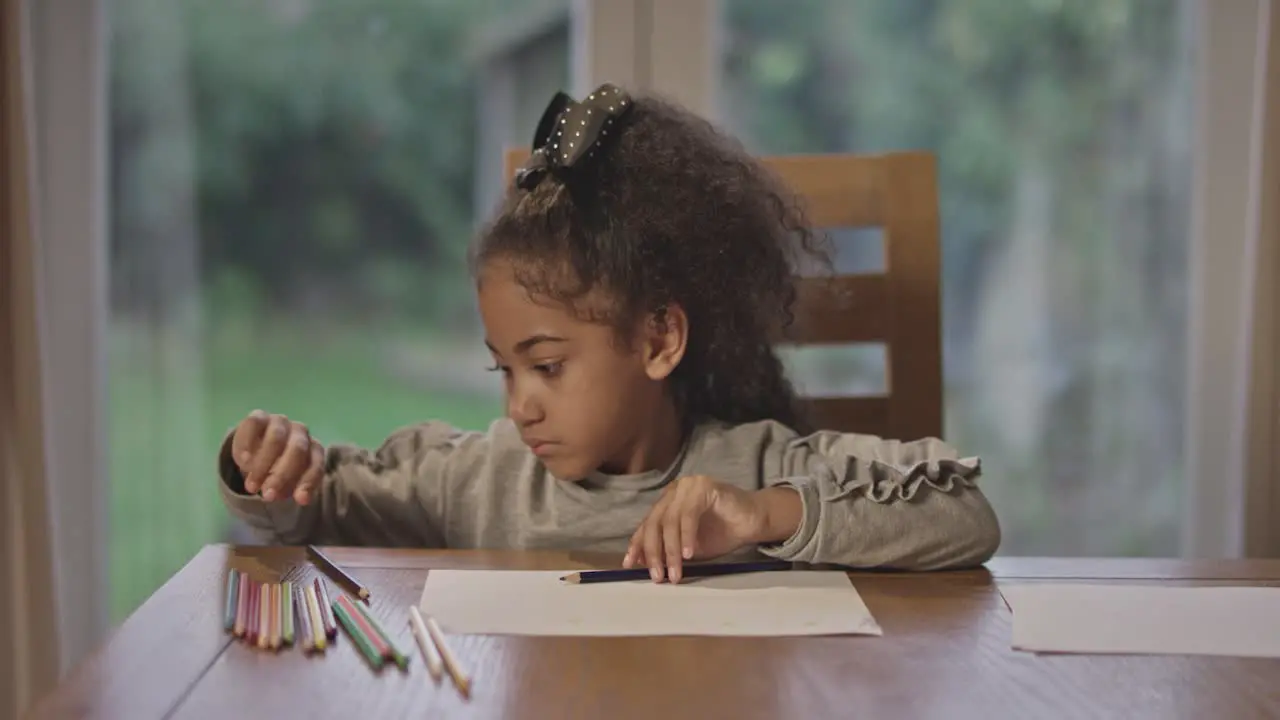 Young Girl Choosing Colored Pencil