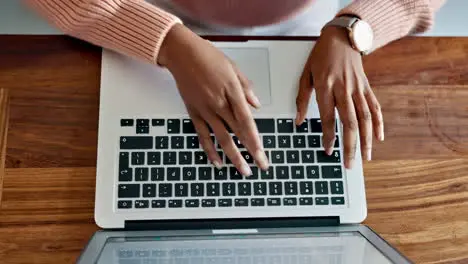 Laptop typing on keyboard and student