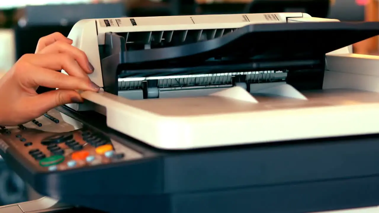 Executives using photocopy machine in office