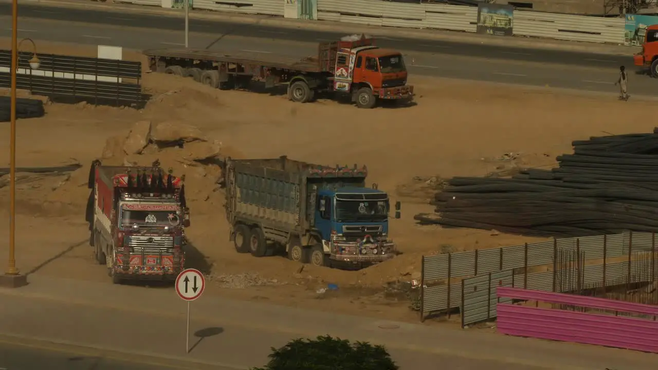 Parked Lorries At Building Site In Karachi