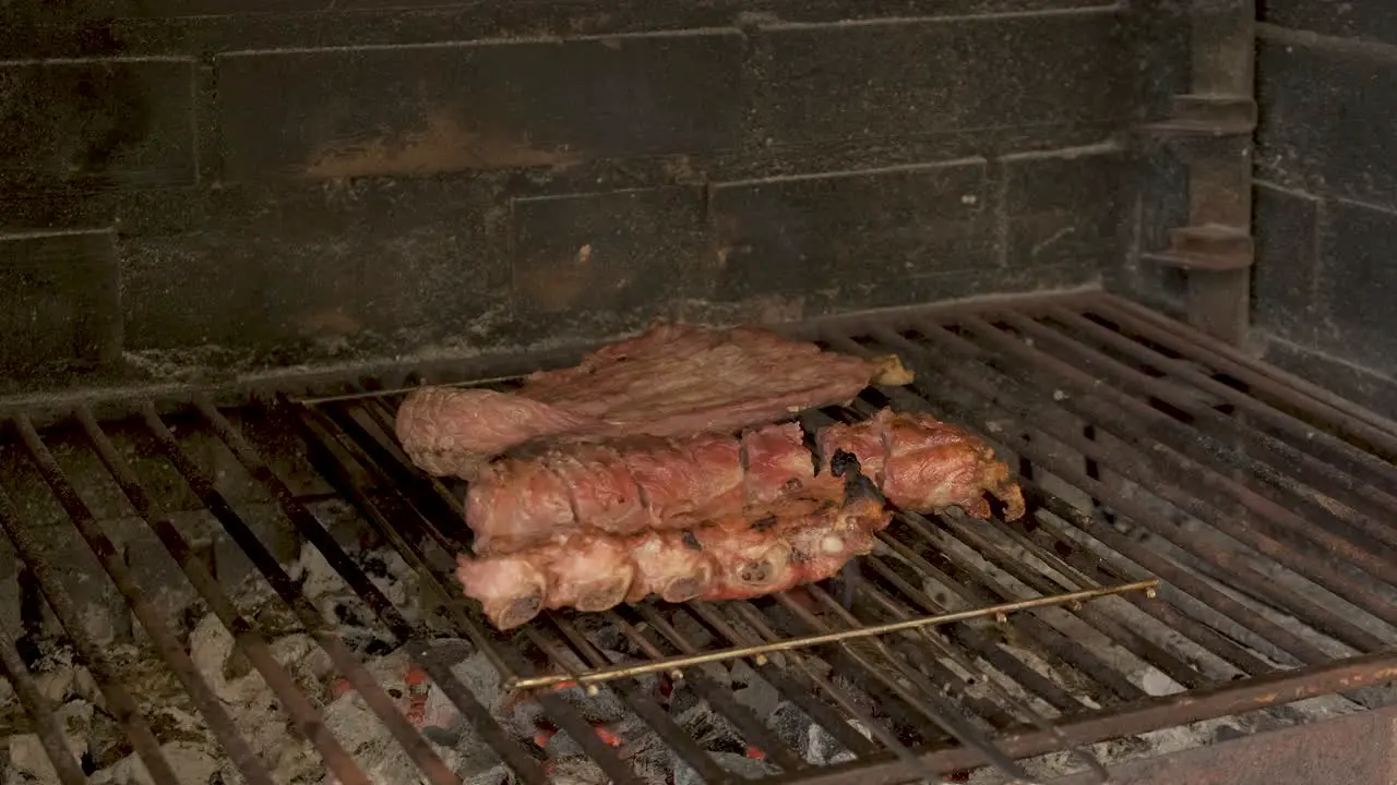 Close up of meat on grill in stone barbecue