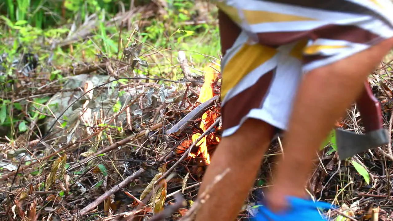 Man starts a fire in the forest