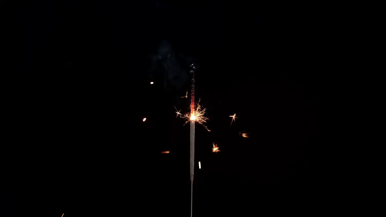 Sparklers fireworks burning on black background for New Year's Eve celebration Christmas special event holiday