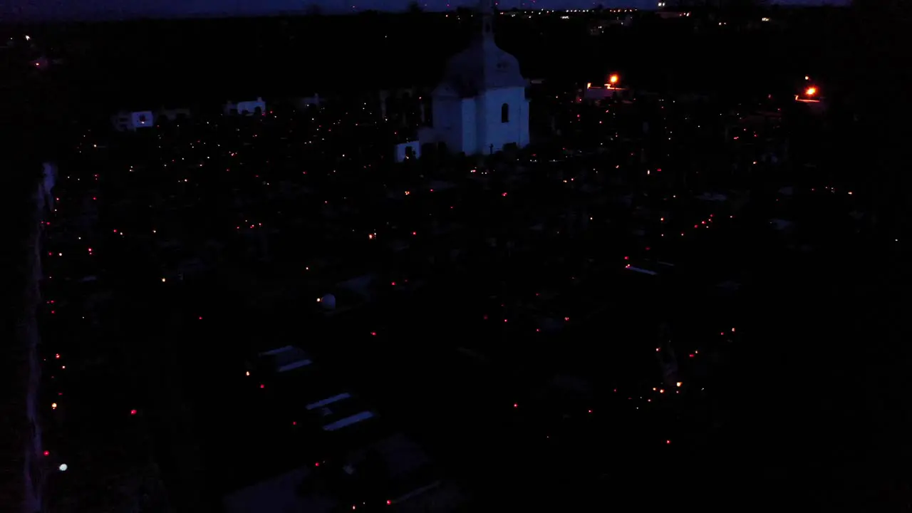 Grave Candles In Cemetery During All Saints' Day In The Evening