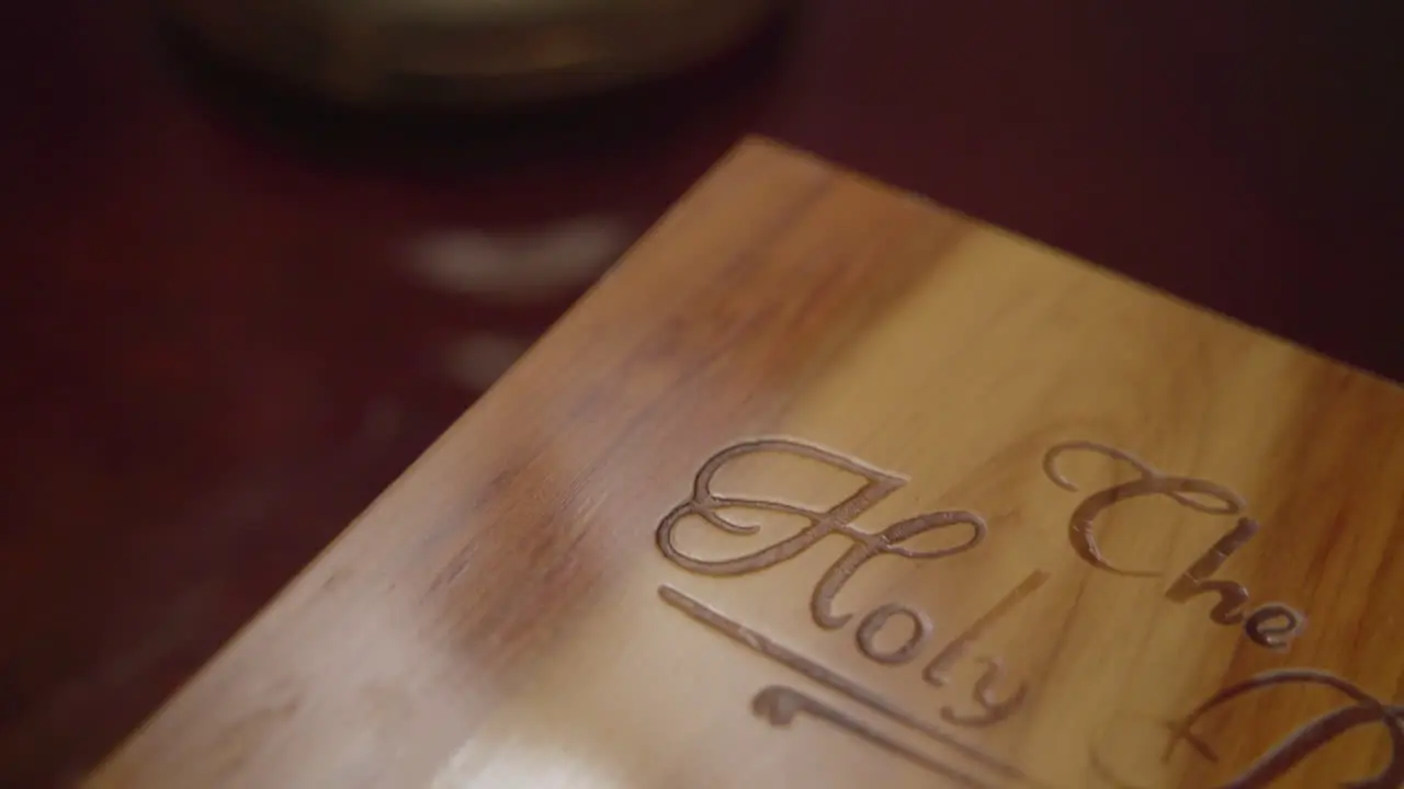 Close up of wooden book box labeled The Holy Bible