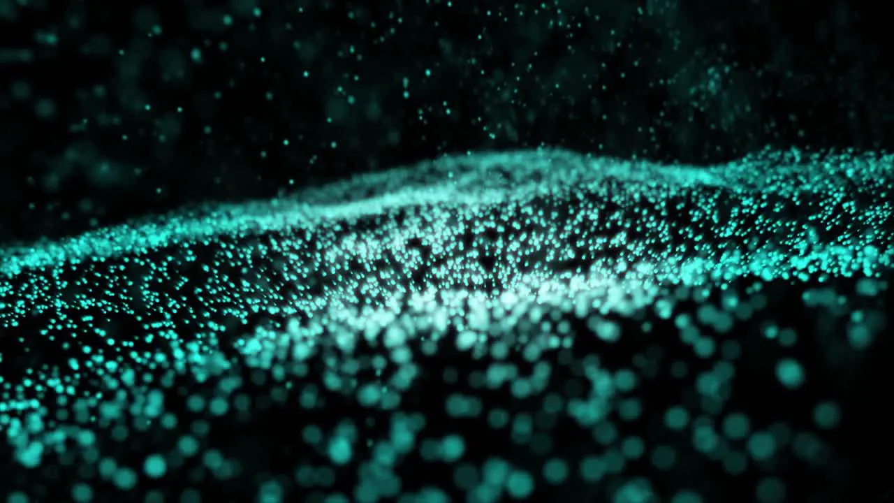 Animation of abstract blue flickering particles in motion on a black background blue particles focus