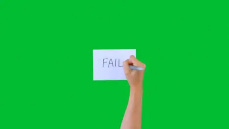 Woman Writing Fail on Paper with Green Screen