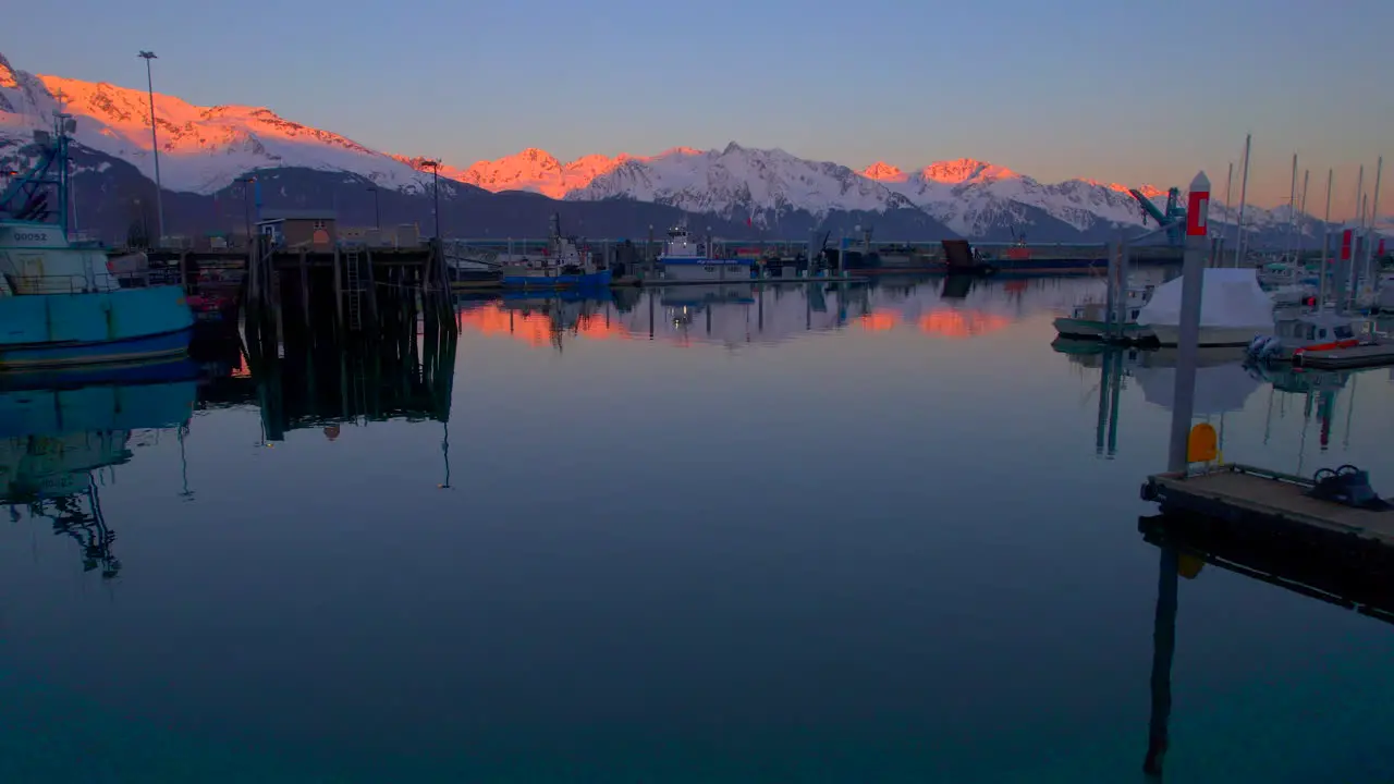 Seward Alaska Boat Harbor with view of mountains at sunset