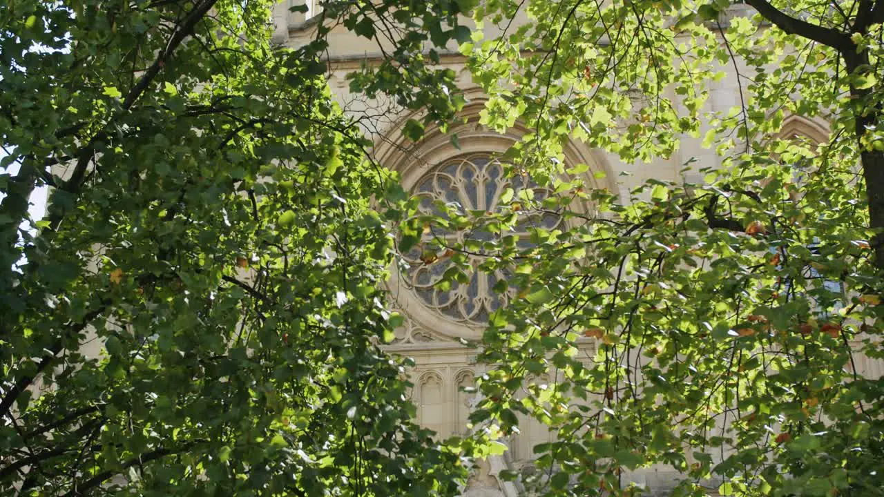 Narrow view of the Rose Window of the Church of San Lorenzo in Hijon Asturias Handheld Slow Motion