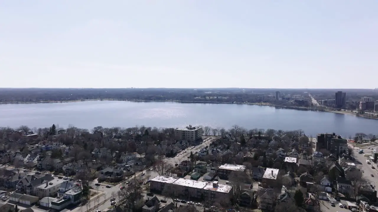 push in drone aerial shot of a lake in the spring time in minnesota