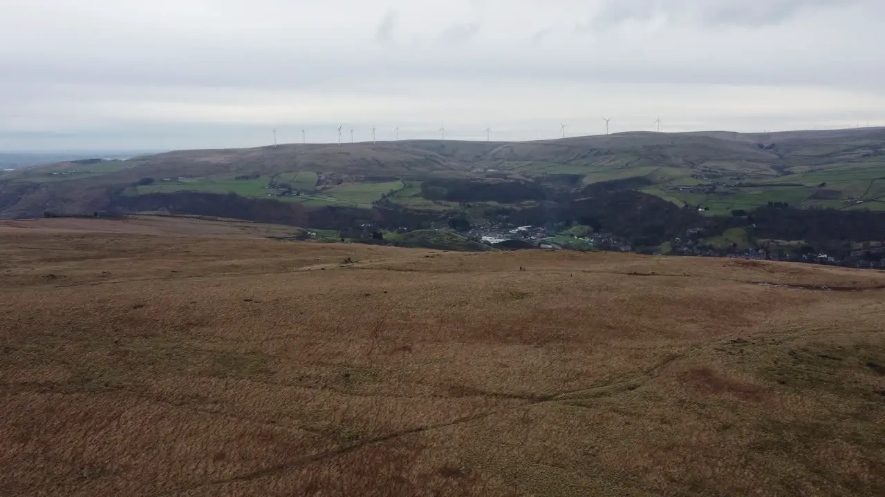 Aerial flying over beautiful fields landscape shot with hills and fields