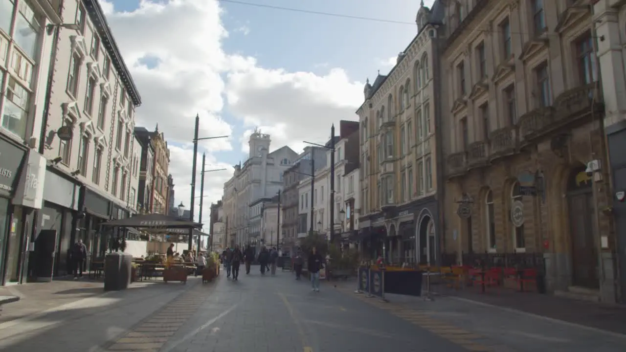 Walking Along Pedestrianised Street In Cardiff City Centre Wales With Tourists