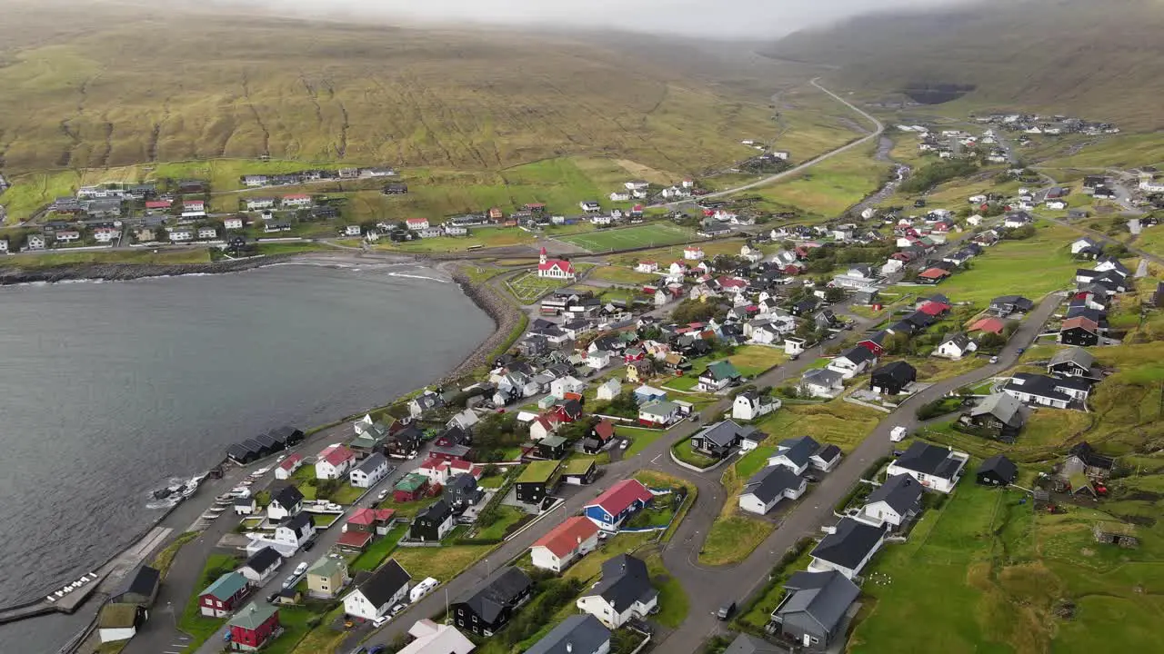 Rising drone footage of the Sandavagur village on the Vagar island in the Faroe Islands