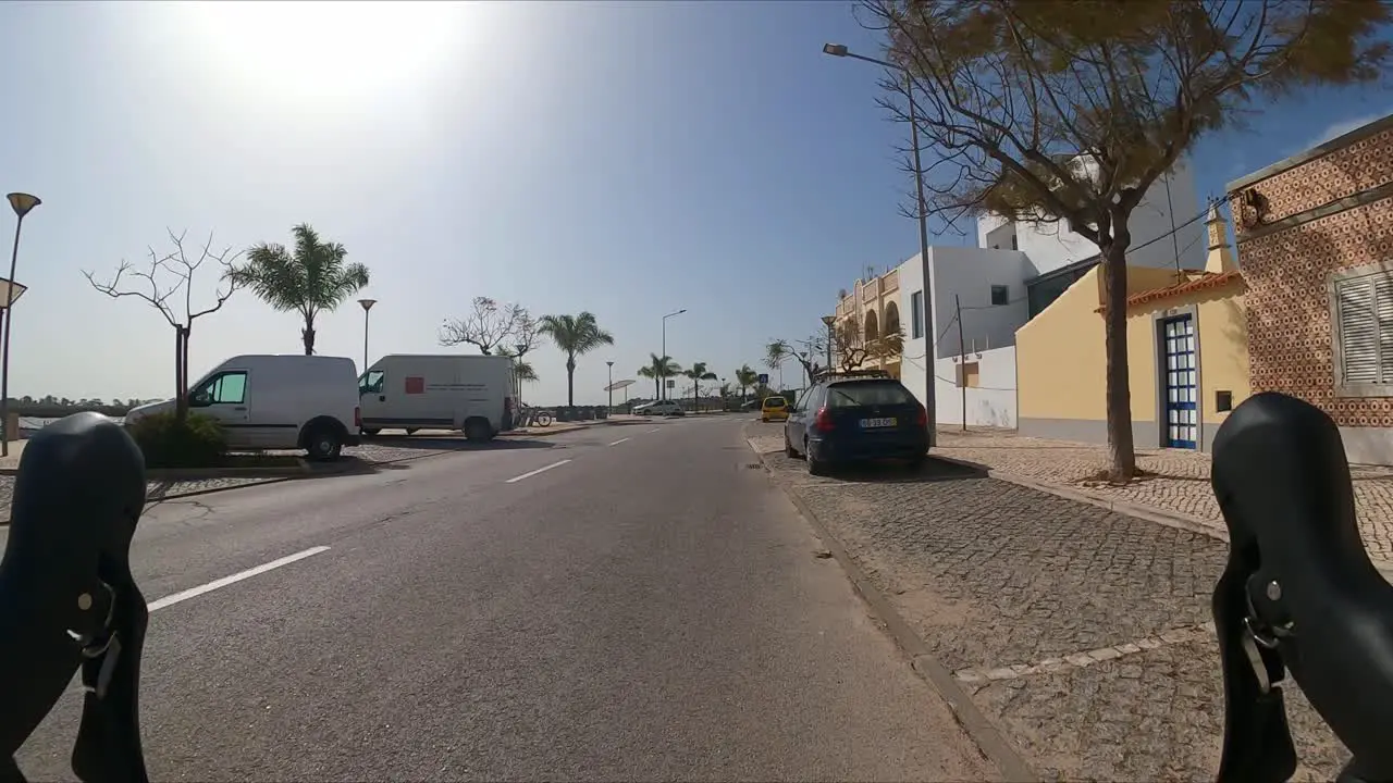 Cycling the Algarve Portugal typical seaside town relaxing on a warm spring day