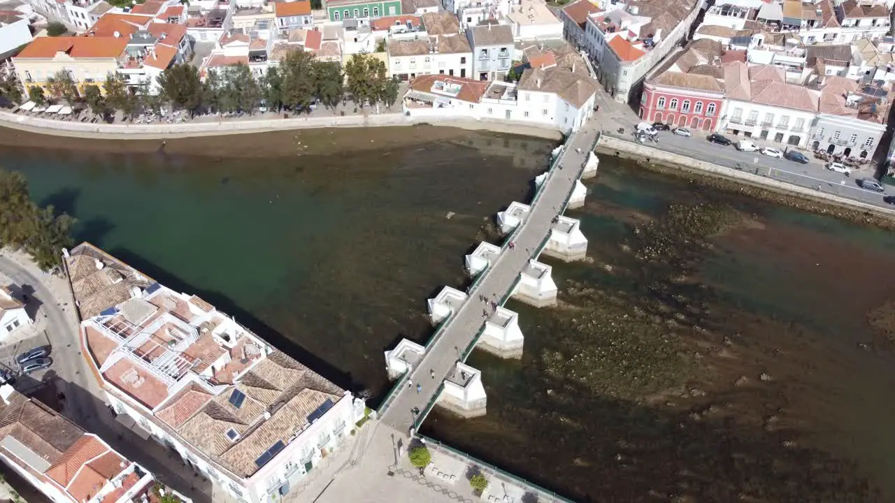 Circling Shot of The Ponte Romana Bridge on the river Gala Tavira Algarve Portugal a traditional old town on the edge of the Atlantic sea