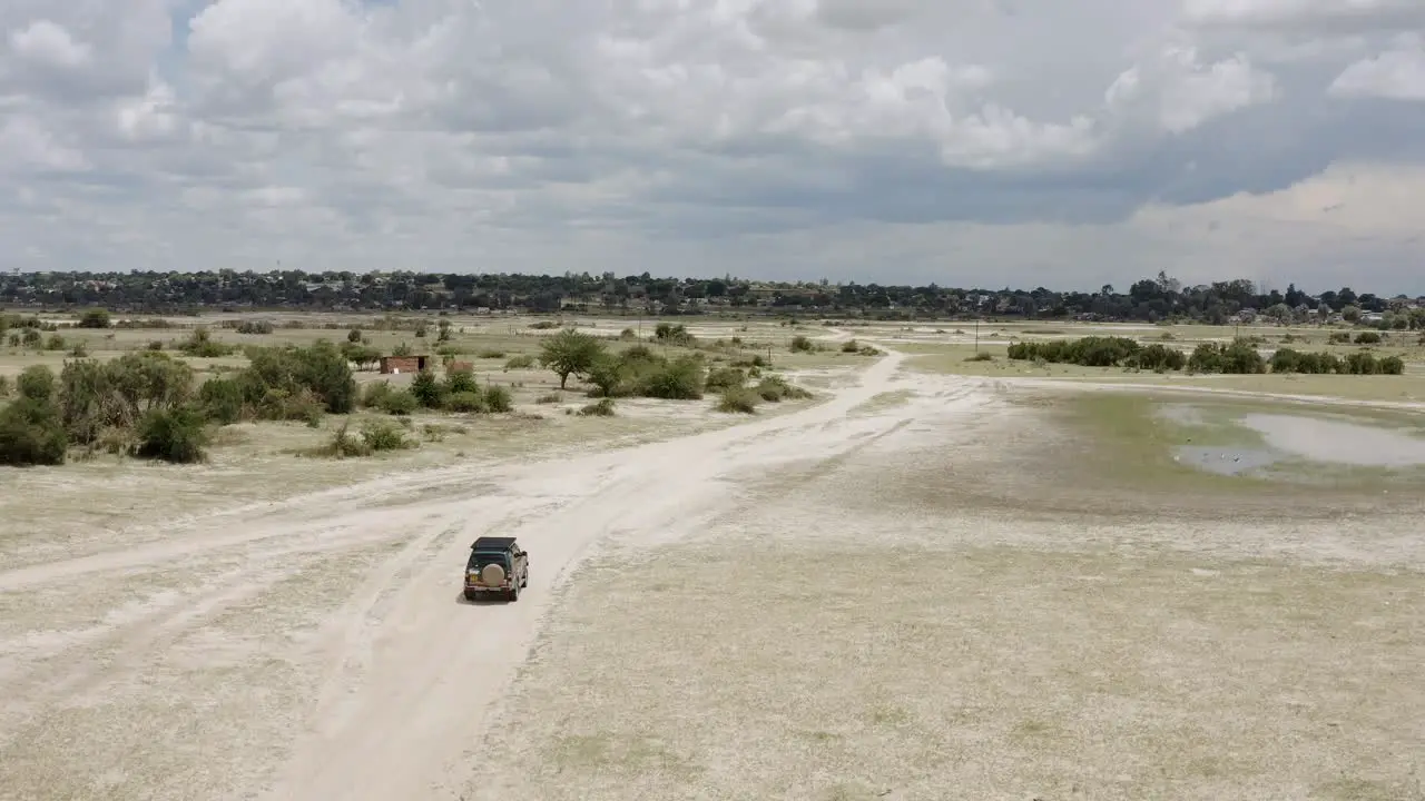 jeep driving in African savanna