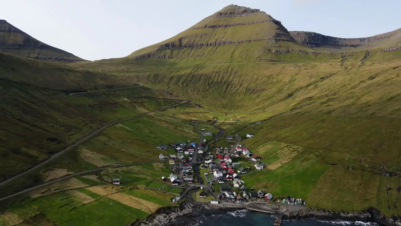 Drone footage of the Funningur village revealing the Slættaratindur mountain on the Eysturoy island in the Faroe Islands