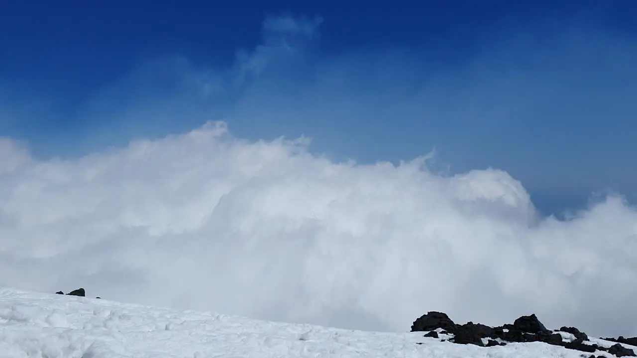 timelapse of fast moving clouds near the volcano Etna on the island of sicily in Italy sunny weather blue skies