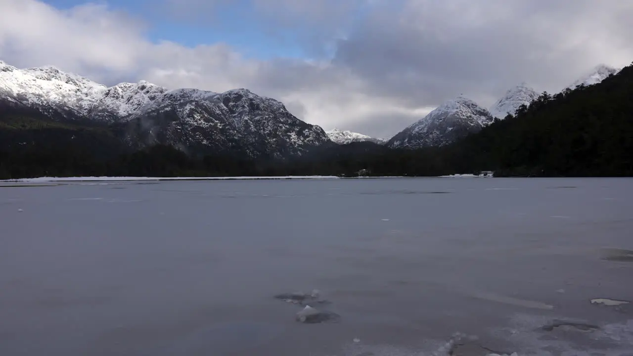 Time-lapse of frozen lagoon with snow-capped mountains in Patagonia Argentina