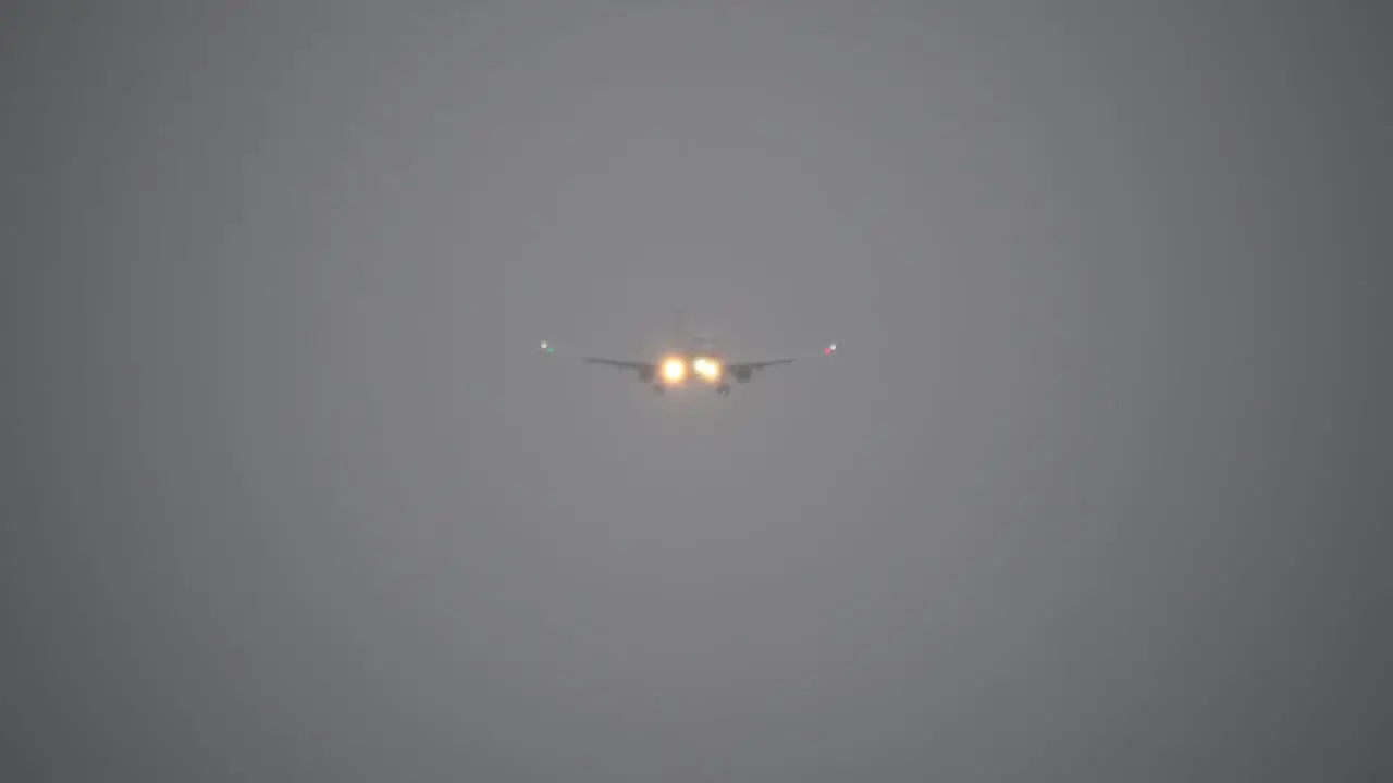 A plane flying in the gloomy sky