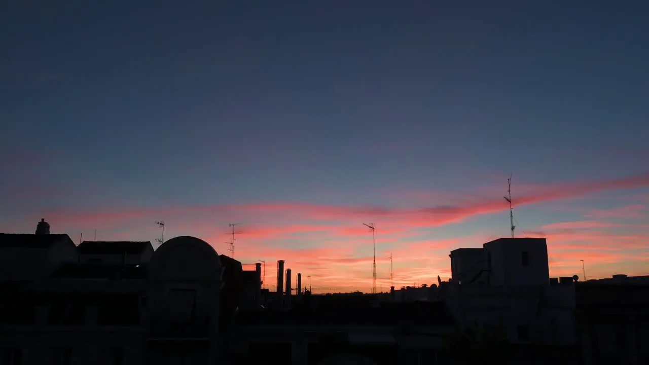 Beautiful soft color palette Summer sunset and sky seen in downtown Madrid Spain