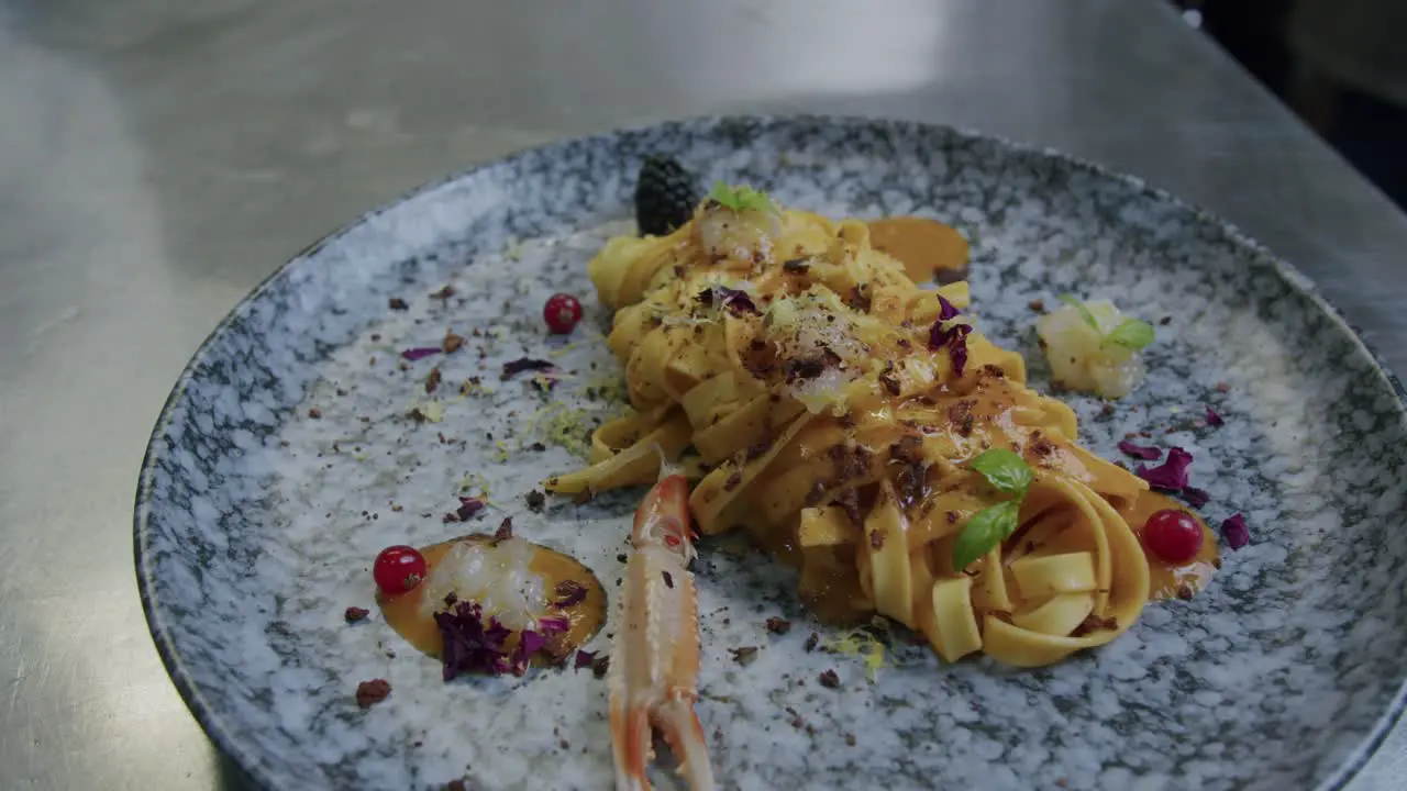 Close up shot of a plate full of pasta and scampi made from a professional chef in Italy 01