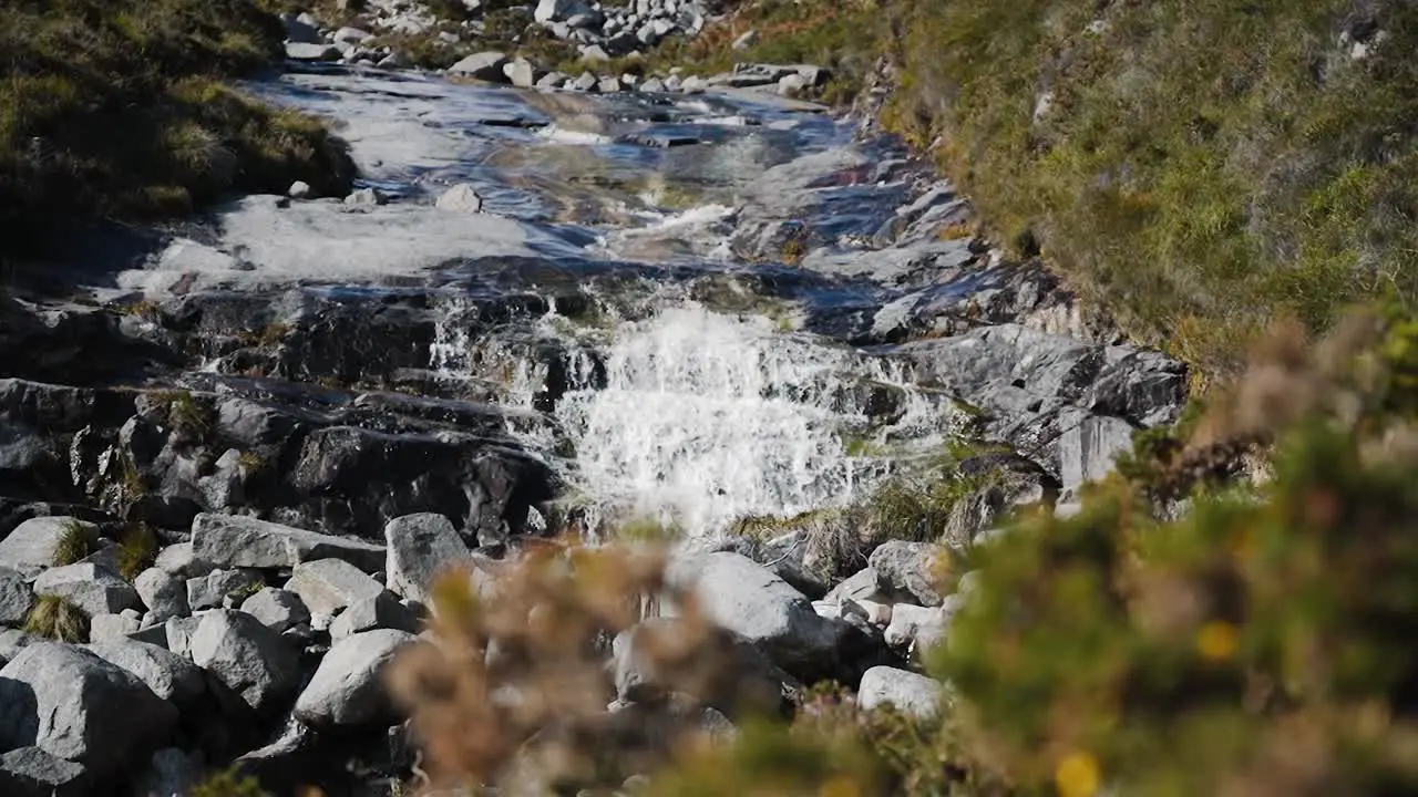 Low angle view of small natural waterfall