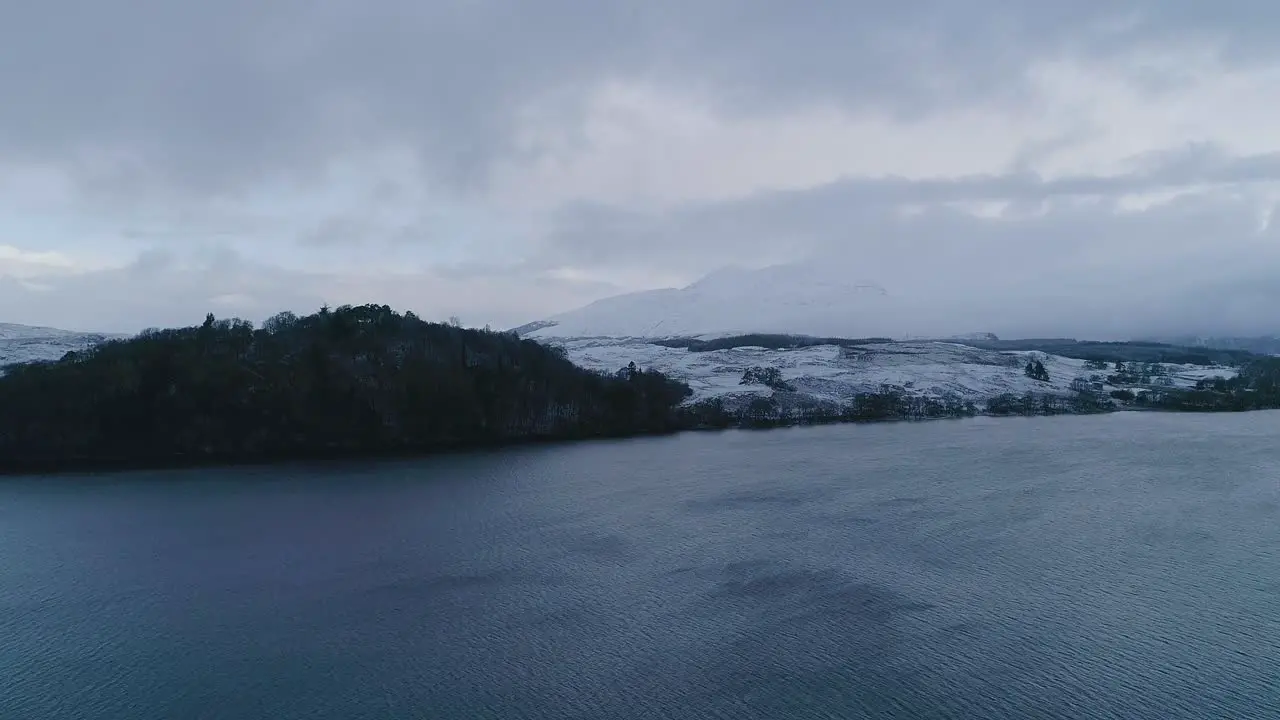 Aerial shot of a snowy capped Ben Cruachan a mountain in Argyll and Bute Scotland