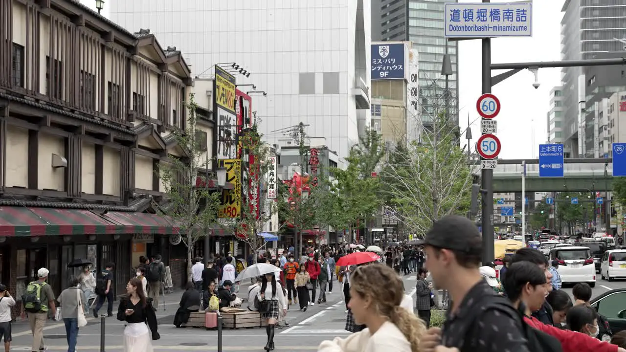 Crowded Midosuji Avenue Pavement Near Namba Station In Osaka On Overcast Day