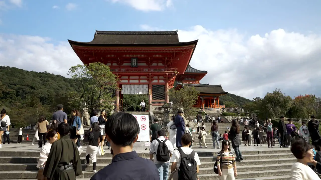 Tourists Standing Around Stairs Leading To Niomon Gate At Kiyomizu Dera In Kyoto